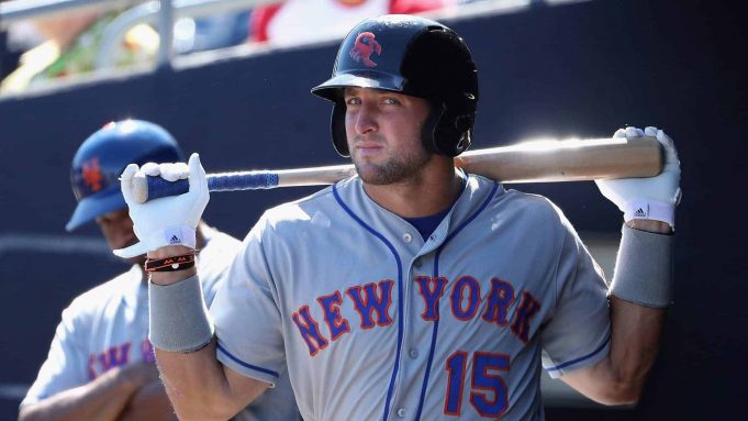 PEORIA, AZ - OCTOBER 13: Tim Tebow #15 (New York Mets) of the Scottsdale Scorpions warms up in the dugout during the Arizona Fall League game against the Peoria Javelinas at Peoria Stadium on October 13, 2016 in Peoria, Arizona.