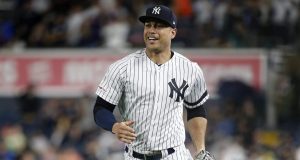 NEW YORK, NEW YORK - JUNE 18: Giancarlo Stanton #27 of the New York Yankees as he runs to the dugout after the first inning against the Tampa Bay Rays at Yankee Stadium on June 18, 2019 in New York City.
