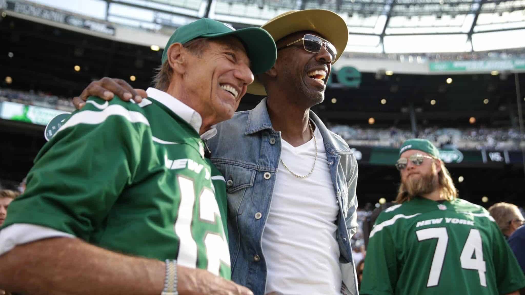 EAST RUTHERFORD, NEW JERSEY - OCTOBER 13: Hall of Famer Joe Namath and J. B. Smoove pose for pictures before the game between the New York Jets and the Dallas Cowboys at MetLife Stadium on October 13, 2019 in East Rutherford, New Jersey.