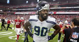 GLENDALE, ARIZONA - SEPTEMBER 29: Defensive end Jadeveon Clowney #90 of the Seattle Seahawks smiles following a 27-10 victory against the Arizona Cardinals during the the NFL football game at State Farm Stadium on September 29, 2019 in Glendale, Arizona.