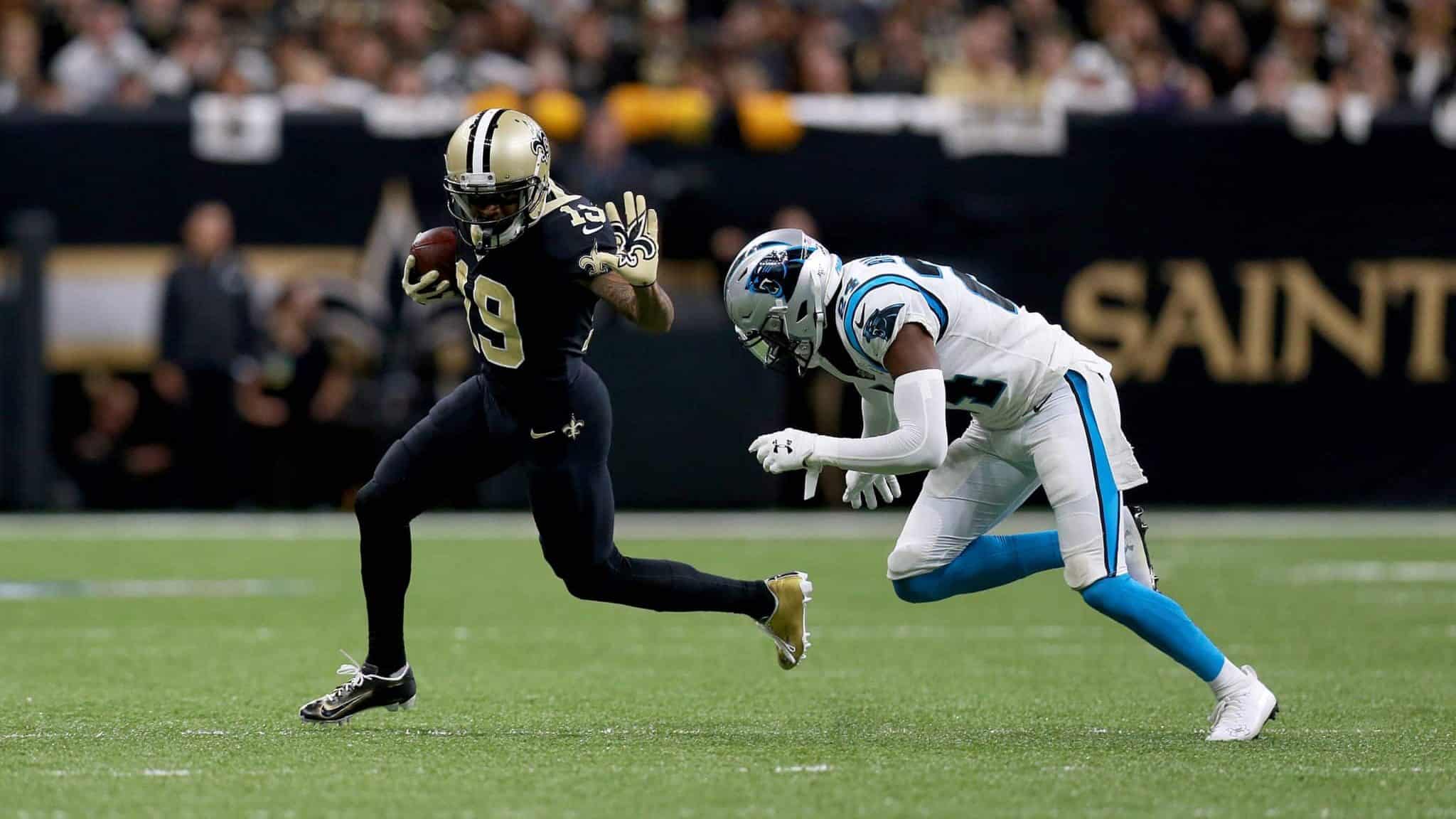 NEW ORLEANS, LOUISIANA - NOVEMBER 24: Ted Ginn #19 of the New Orleans Saints breaks a tackle against James Bradberry #24 of the Carolina Panthers during the first quarter in the game at Mercedes Benz Superdome on November 24, 2019 in New Orleans, Louisiana.