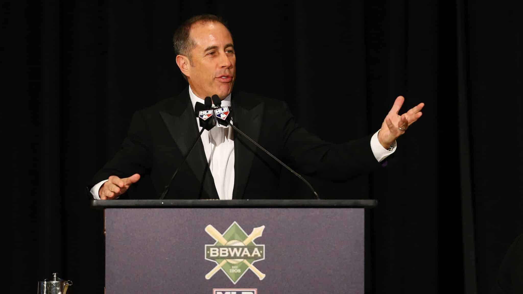 NEW YORK, NEW YORK - JANUARY 25: Jerry Seinfeld speaks prior to presenting Pete Alonso of the New York Mets with the 2019 National League Rookie Of The Year Award during the 97th annual New York Baseball Writers' Dinner on January 25, 2020 Sheraton New York in New York City.