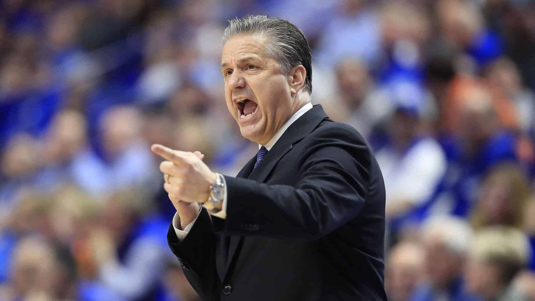 LEXINGTON, KENTUCKY - MARCH 03: John Calipari the head coach of the Kentucky Wildcats gives instructions to his team against the Tennessee Volunteers at Rupp Arena on March 03, 2020 in Lexington, Kentucky.