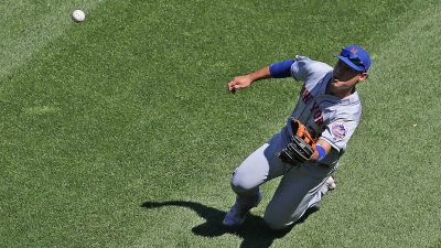 CHICAGO, ILLINOIS - AUGUST 01: Michael Conforto #30 of the New York Mets makes a sliding catch to end the 7th inning against the Chicago White Sox at Guaranteed Rate Field on August 01, 2019 in Chicago, Illinois.