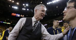 In this June 4, 2015, photo, Mike Breen, NBA play-by-play sports commentator for ABC, greets fans before Game 1 of basketball's NBA Finals between the Golden State Warriors and Cleveland Cavaliers in Oakland, Calif. Breen is calling his 10th NBA Finals, a record for a TV play-by-play announcer.