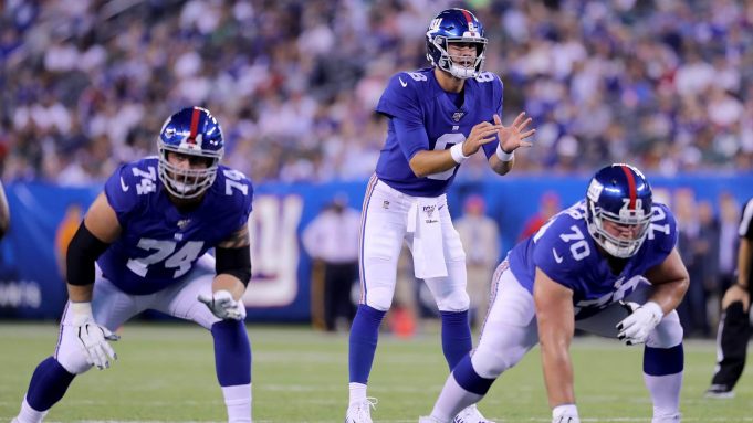 EAST RUTHERFORD, NEW JERSEY - AUGUST 08: Daniel Jones #8 of the New York Giants calls the play as Mike Remmers #74 and Kevin Zeitler #70 wait for the snap in the first quarter against the New York Jets during a preseason matchup at MetLife Stadium on August 08, 2019 in East Rutherford, New Jersey.