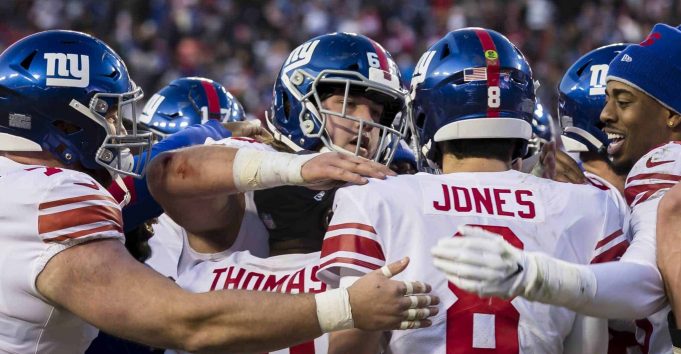 LANDOVER, MD - DECEMBER 22: Daniel Jones #8 of the New York Giants celebrates with teammates after throwing the game winning touchdown against the Washington Redskins during overtime at FedExField on December 22, 2019 in Landover, Maryland.