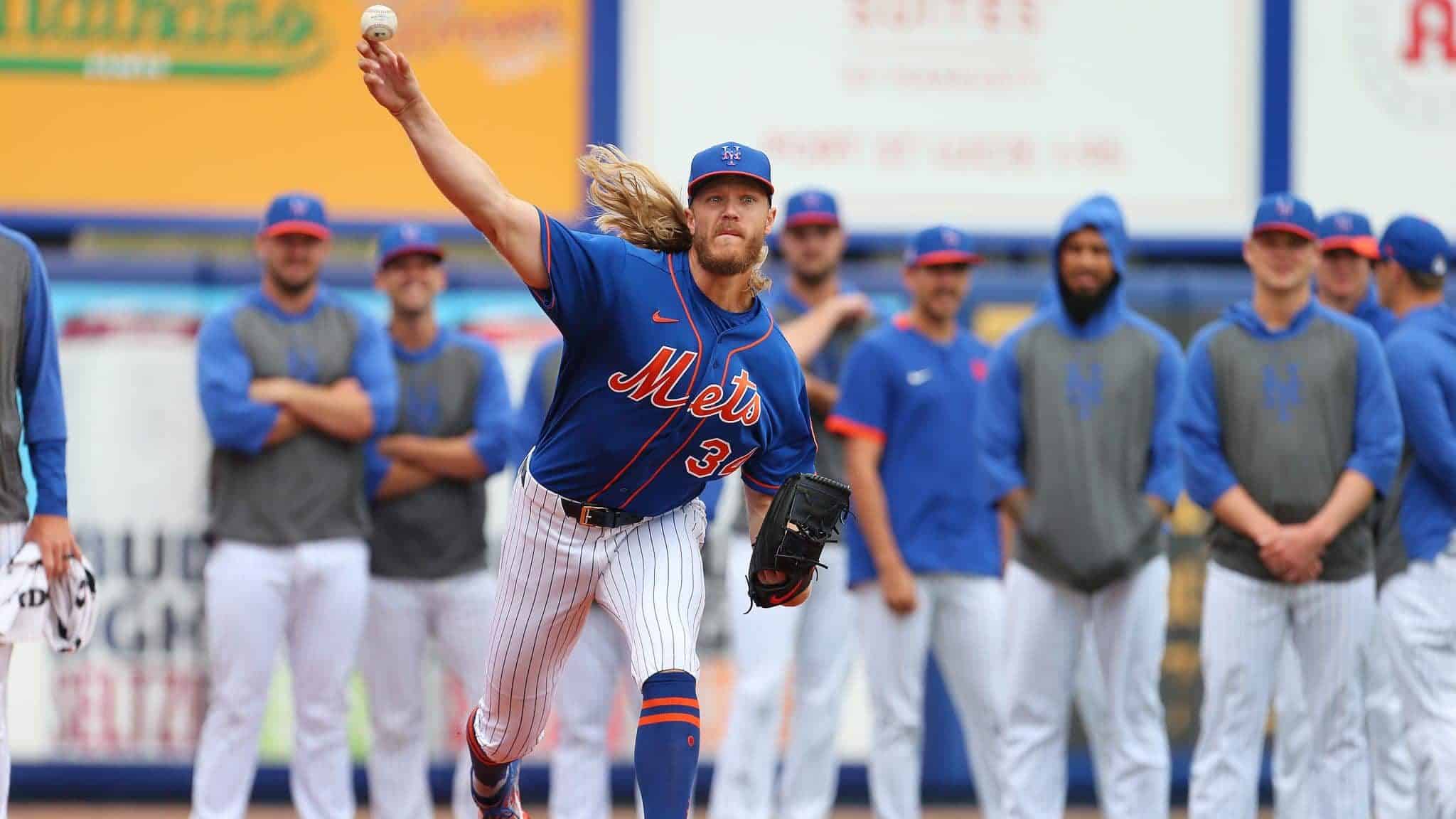 PORT ST. LUCIE, FL - MARCH 08: Pitcher Noah Syndergaard #34 of the New York Mets warms up in the bullpen in front of his fellow pitches before a spring training baseball game against the Houston Astros at Clover Park on March 8, 2020 in Port St. Lucie, Florida. The Mets defeated the Astros 3-1.