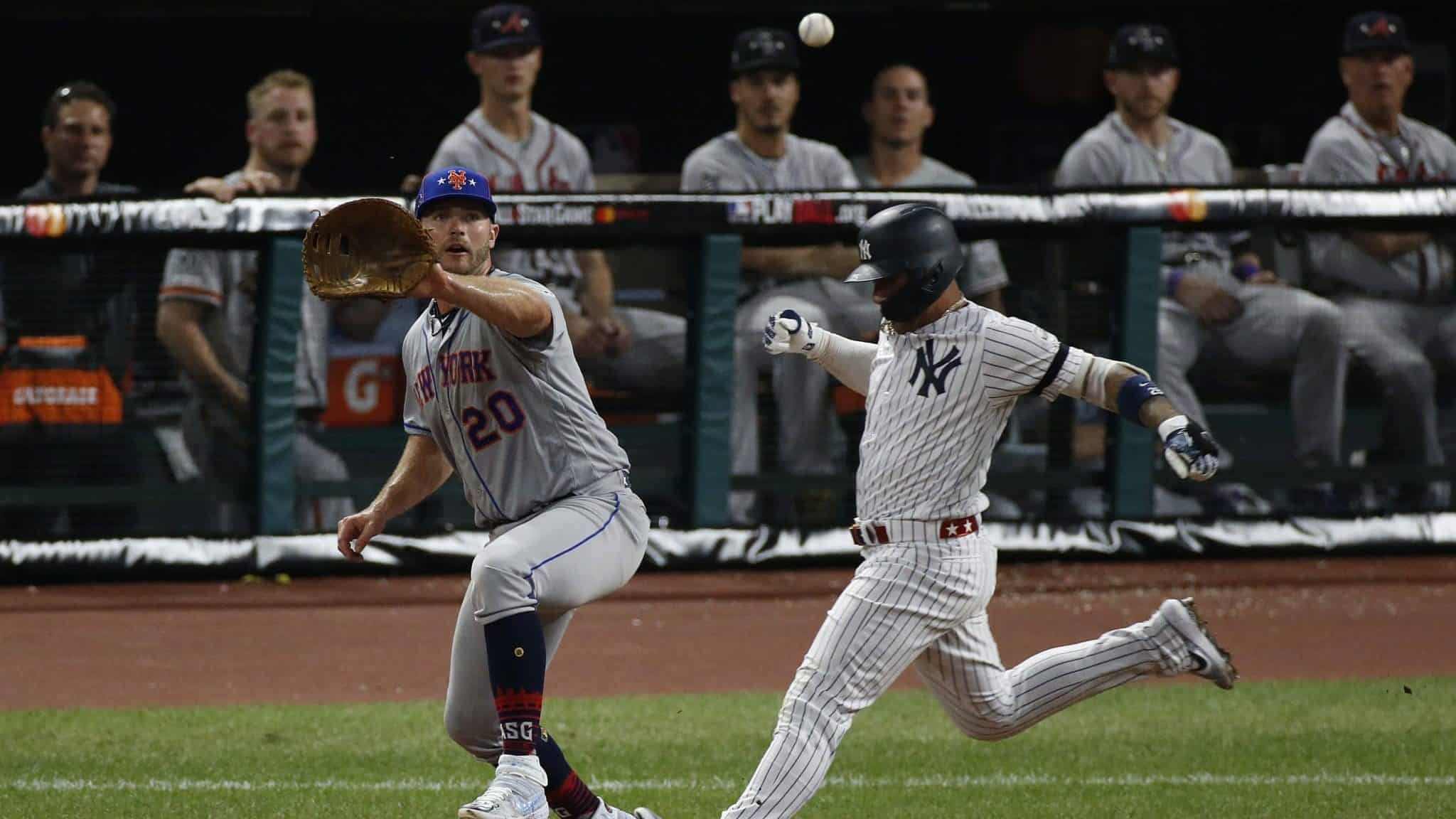 CLEVELAND, OHIO - JULY 09: Pete Alonso #20 of the New York Mets and Gleyber Torres #25 of the New York Yankees during the 2019 MLB All-Star Game at Progressive Field on July 09, 2019 in Cleveland, Ohio.