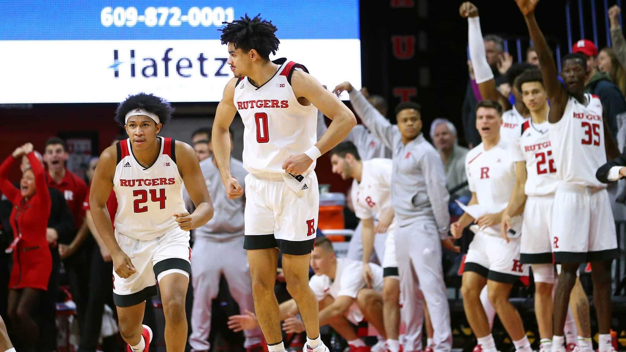 PISCATAWAY, NJ - JANUARY 09: Geo Baker #0 of the Rutgers Scarlet Knights reacts after scoring the game winning three-point basket defeating the Ohio State Buckeyes 64-61 in a game at Rutgers Athletic Center on January 9, 2019 in Piscataway, New Jersey.