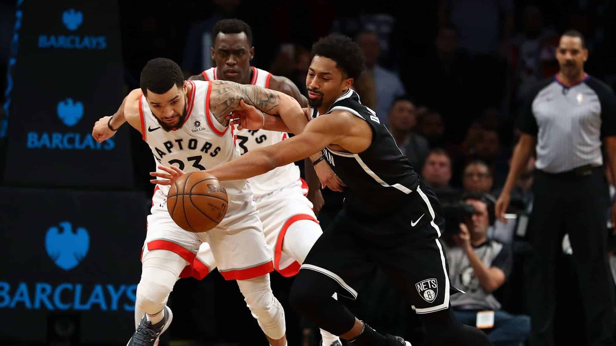 NEW YORK, NY - JANUARY 08: Fred VanVleet #23 of the Toronto Raptors and Spencer Dinwiddie #8 of the Brooklyn Nets battle for the ball during their game at Barclays Center on January 8, 2018 in New York City.