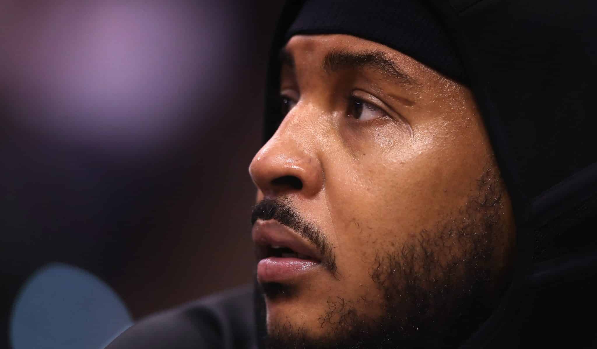 PHOENIX, ARIZONA - DECEMBER 16: Carmelo Anthony #00 of the Portland Trail Blazers sits on the bench during the first half of the NBA game against the Phoenix Suns at Talking Stick Resort Arena on December 16, 2019 in Phoenix, Arizona.