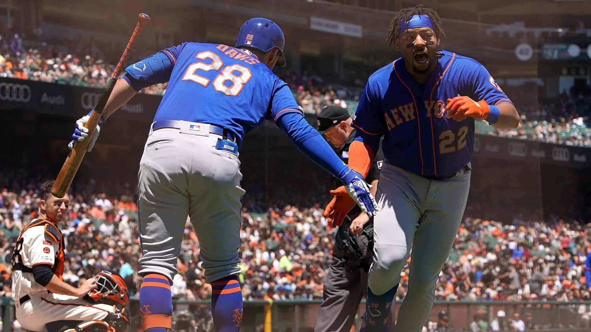 SAN FRANCISCO, CA - JULY 20: Dominic Smith #22 of the New York Mets is congratulated by J.D. Davis #28 after Smith hit a solo home run against the San Francisco Giants in the top of the second inning at Oracle Park on July 20, 2019 in San Francisco, California.