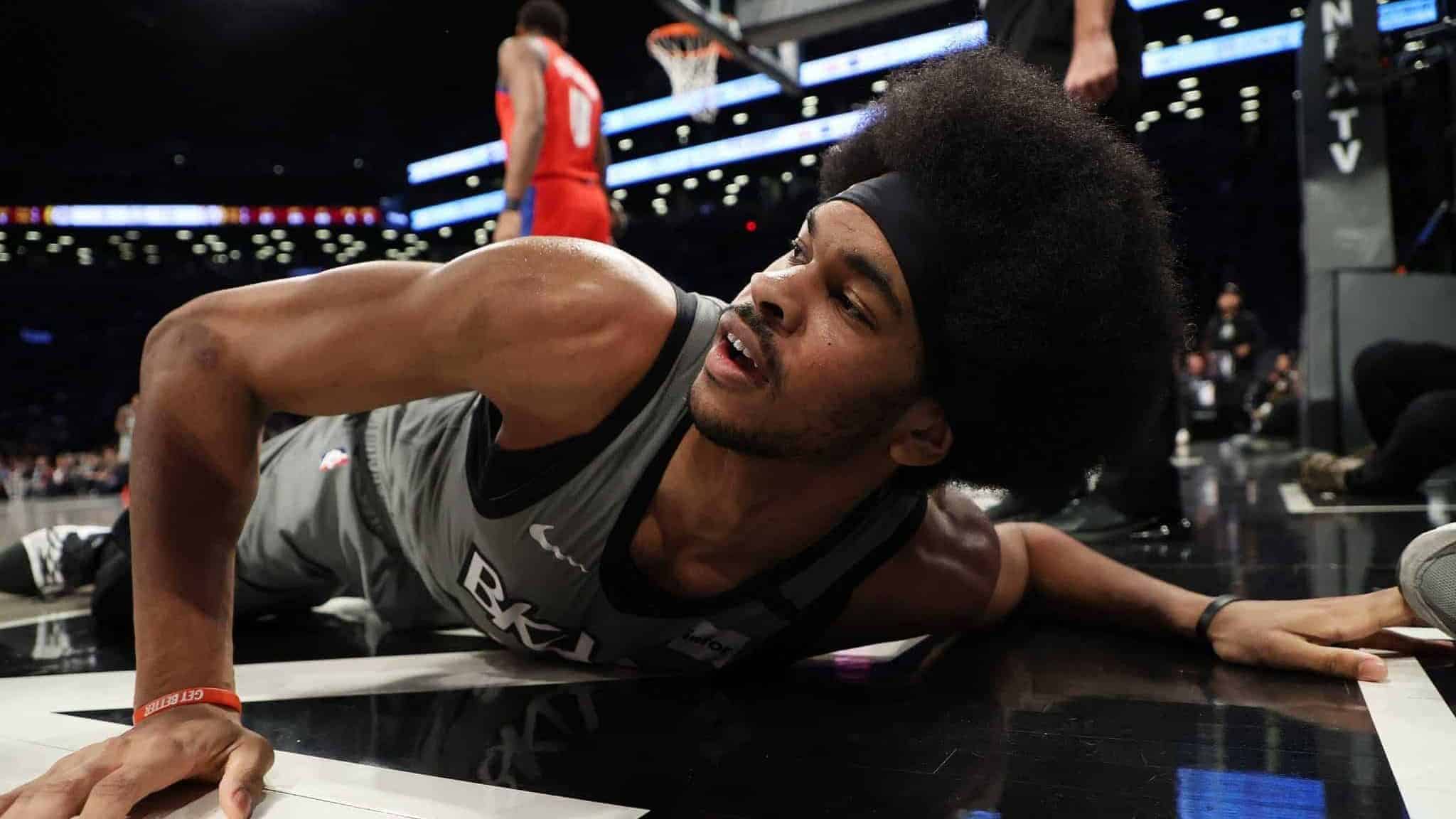 NEW YORK, NEW YORK - JANUARY 29: Jarrett Allen #31 of the Brooklyn Nets falls against the Detroit Pistons during their game at Barclays Center on January 29, 2020 in New York City.