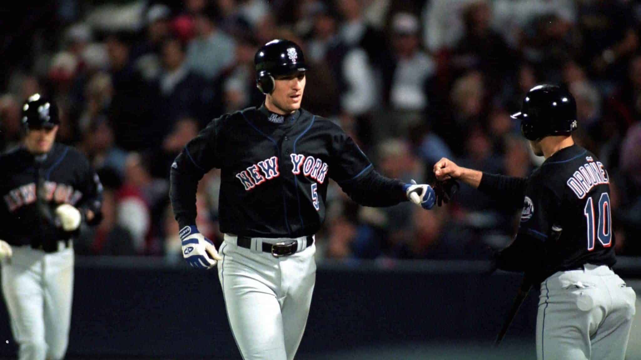 19 Oct 1999: John Olerud #5 of the New York Mets celebrates as he runs the base during the National League Championship Series game six against the Atlanta Braves at Turner Field in Atlanta, Georgia. The Braves defeated the Mets 10-9.