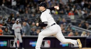 NEW YORK, NEW YORK - OCTOBER 17: Adam Ottavino #0 of the New York Yankees delivers the pitch against the Houston Astros during the eighth inning in game four of the American League Championship Series at Yankee Stadium on October 17, 2019 in New York City.