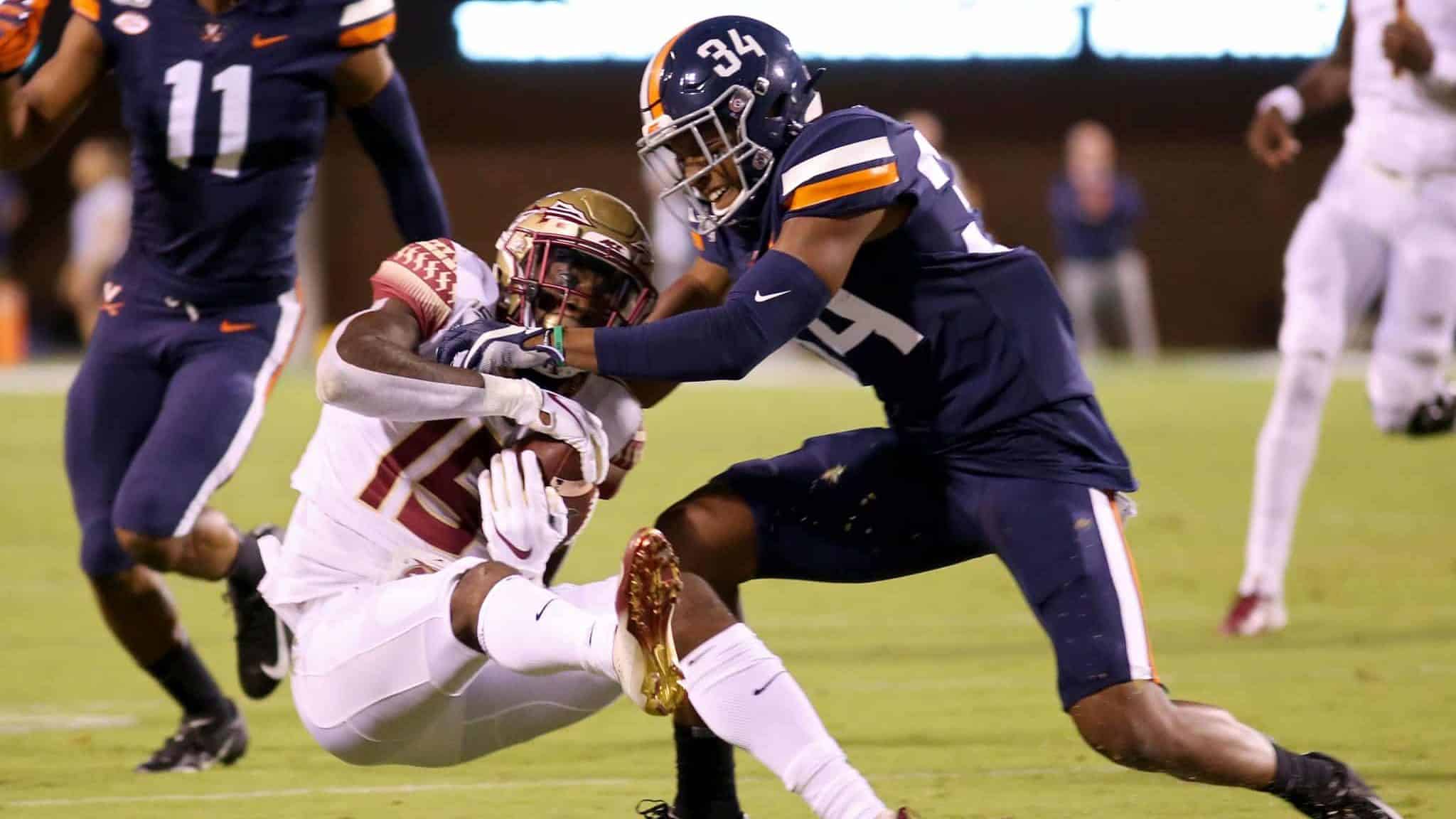 CHARLOTTESVILLE, VA - SEPTEMBER 14: Bryce Hall #34 of the Virginia Cavaliers breaks up a pass intended for Tamorrion Terry #15 of the Florida State Seminoles in the first half during a game at Scott Stadium on September 14, 2019 in Charlottesville, Virginia.