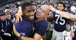 ARLINGTON, TEXAS - DECEMBER 28: Head coach James Franklin of the Penn State Nittany Lions celebrates with Cam Brown #6 of the Penn State Nittany Lions after the Nittany Lions beat the Memphis Tigers 53-39 at AT&T Stadium on December 28, 2019 in Arlington, Texas.
