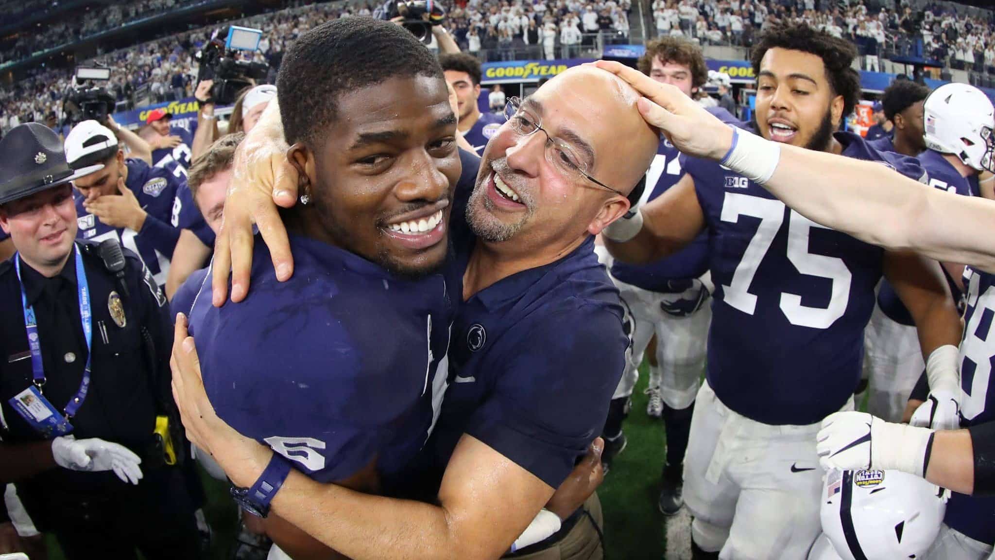 ARLINGTON, TEXAS - DECEMBER 28: Head coach James Franklin of the Penn State Nittany Lions celebrates with Cam Brown #6 of the Penn State Nittany Lions after the Nittany Lions beat the Memphis Tigers 53-39 at AT&T Stadium on December 28, 2019 in Arlington, Texas.