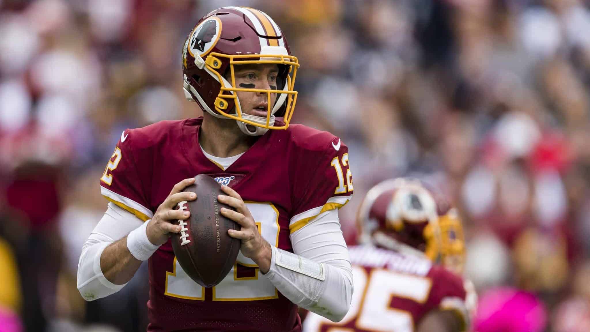 LANDOVER, MD - OCTOBER 06: Colt McCoy #12 of the Washington Redskins looks to pass against the New England Patriots during the first half at FedExField on October 6, 2019 in Landover, Maryland.