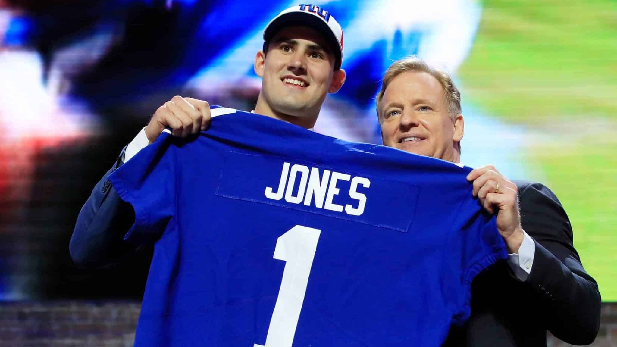 NASHVILLE, TENNESSEE - APRIL 25: Daniel Jones of Duke poses with NFL Commissioner Roger Goodell after being chosen #6 overall by the New York Giants during the first round of the 2019 NFL Draft on April 25, 2019 in Nashville, Tennessee.