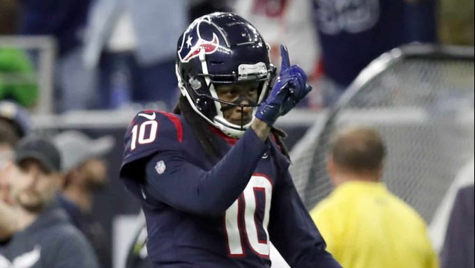 HOUSTON, TEXAS - JANUARY 04: Wide receiver DeAndre Hopkins #10 of the Houston Texans celebrates after a play during the AFC Wild Card Playoff game against the Buffalo Bills at NRG Stadium on January 04, 2020 in Houston, Texas.