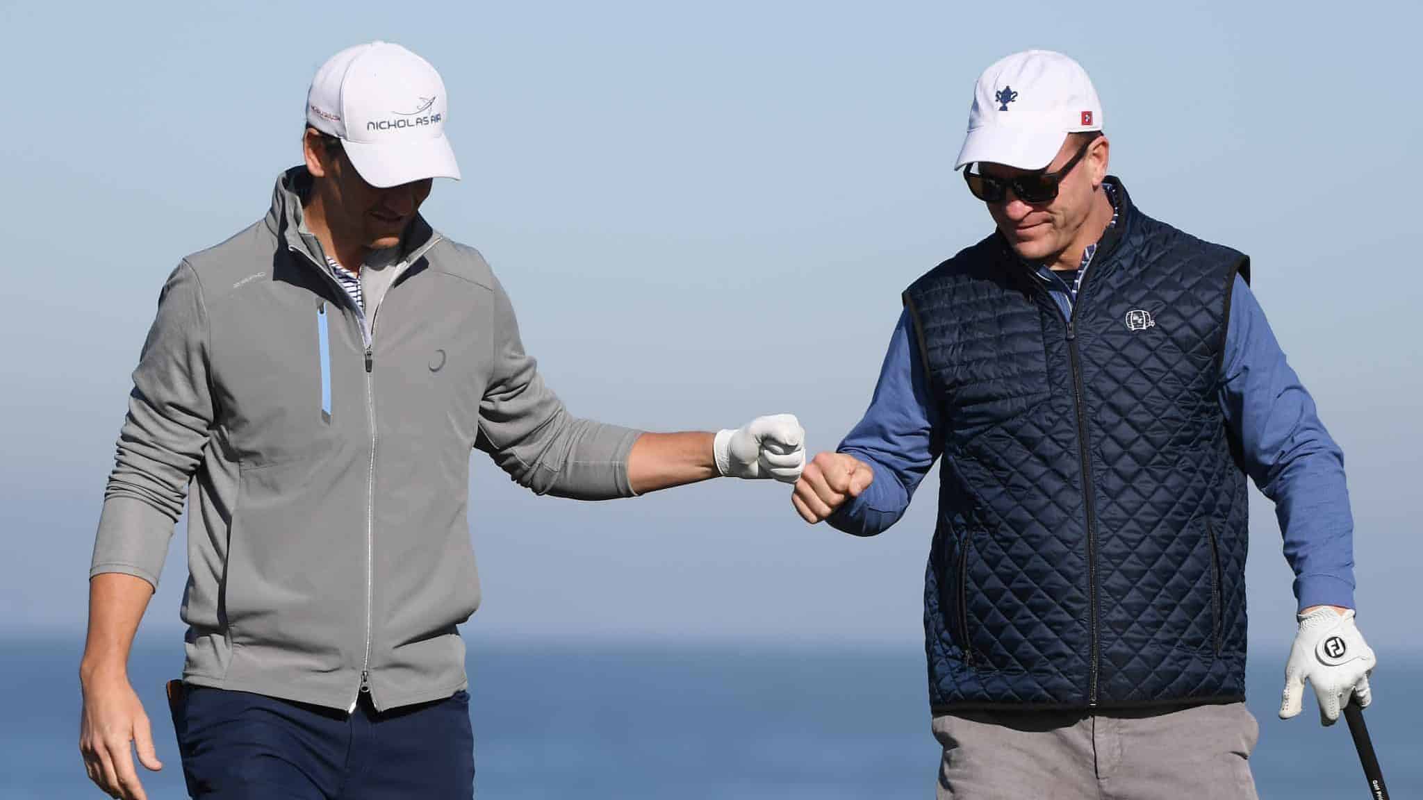 PEBBLE BEACH, CALIFORNIA - FEBRUARY 07: Former NFL players Eli and Peyton Manning celebrate during the second round of the AT&T Pebble Beach Pro-Am at Monterey Peninsula Country Club on February 07, 2020 in Pebble Beach, California.
