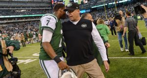 EAST RUTHERFORD, NJ - DECEMBER 22: Head coach Rex Ryan of the New York Jets and quarterback Geno Smith #7 of the New York Jets walk off together at the end of the game against the Cleveland Browns at MetLife Stadium on December 22, 2013 in East Rutherford, New Jersey.