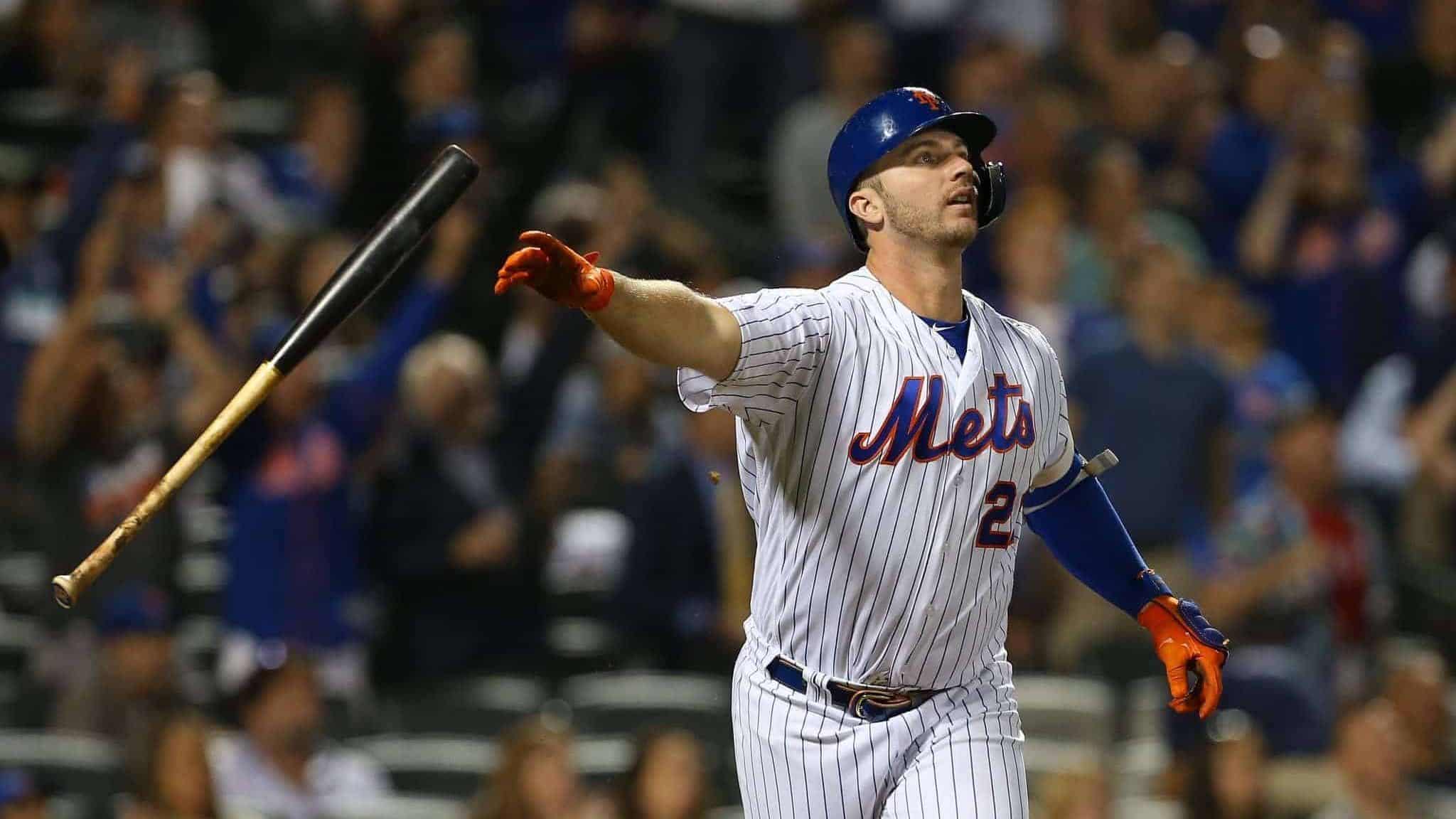NEW YORK, NY - AUGUST 27: Pete Alonso #20 of the New York Mets flips his bat after hitting a home run against the Chicago Cubs during the fourth inning of a game at Citi Field on August 27, 2019 in New York City. The home run is Alonso's 42nd of the season, breaking the previous franchise record.
