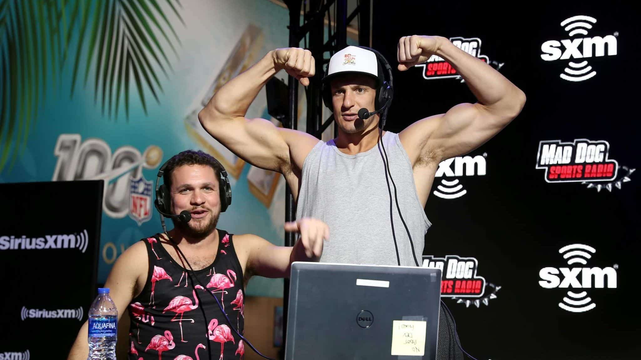MIAMI, FLORIDA - JANUARY 31: (L-R) SiriusXM host Mike Babchik and former NFL player Rob Gronkowski speak onstage during day 3 of SiriusXM at Super Bowl LIV on January 31, 2020 in Miami, Florida.
