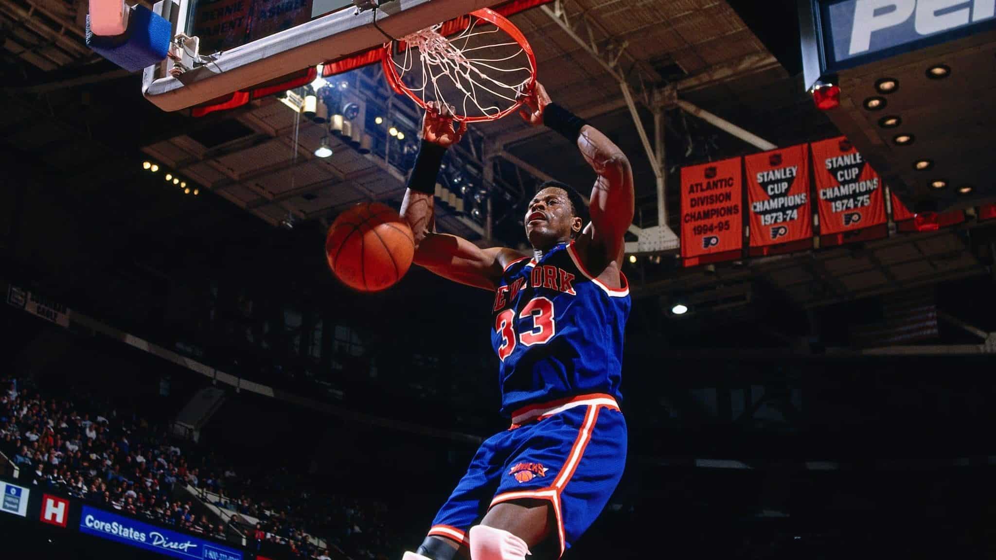 PHILADELPHIA, PA - 1996: Patrick Ewing #33 of the New York Knicks dunks against the Philadelphia 76ers during a game played circa 1996 at the Spectrum in Philadelphia, Pennsylvania. NOTE TO USER: User expressly acknowledges and agrees that, by downloading and or using this photograph, User is consenting to the terms and conditions of the Getty Images License Agreement. Mandatory Copyright Notice: Copyright 1996 NBAE