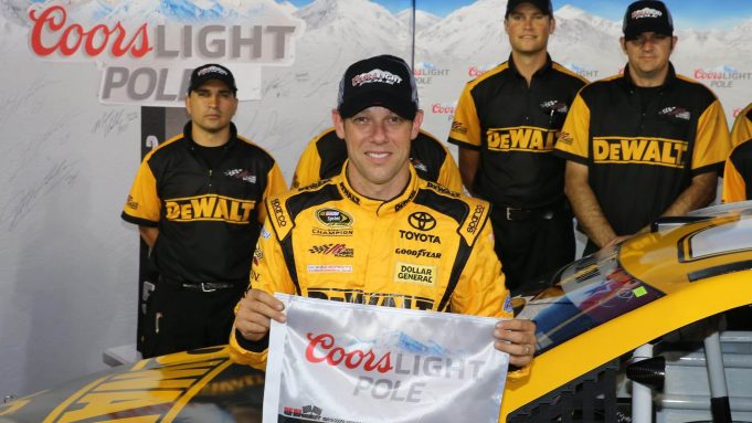 CHARLOTTE, NC - MAY 21: Matt Kenseth, driver of the #20 DeWalt Toyota, poses with the Coors Light Pole Award after qualifying for pole position for the NASCAR Sprint Cup Series Coca-Cola 600 at Charlotte Motor Speedway on May 21, 2015 in Charlotte, North Carolina.