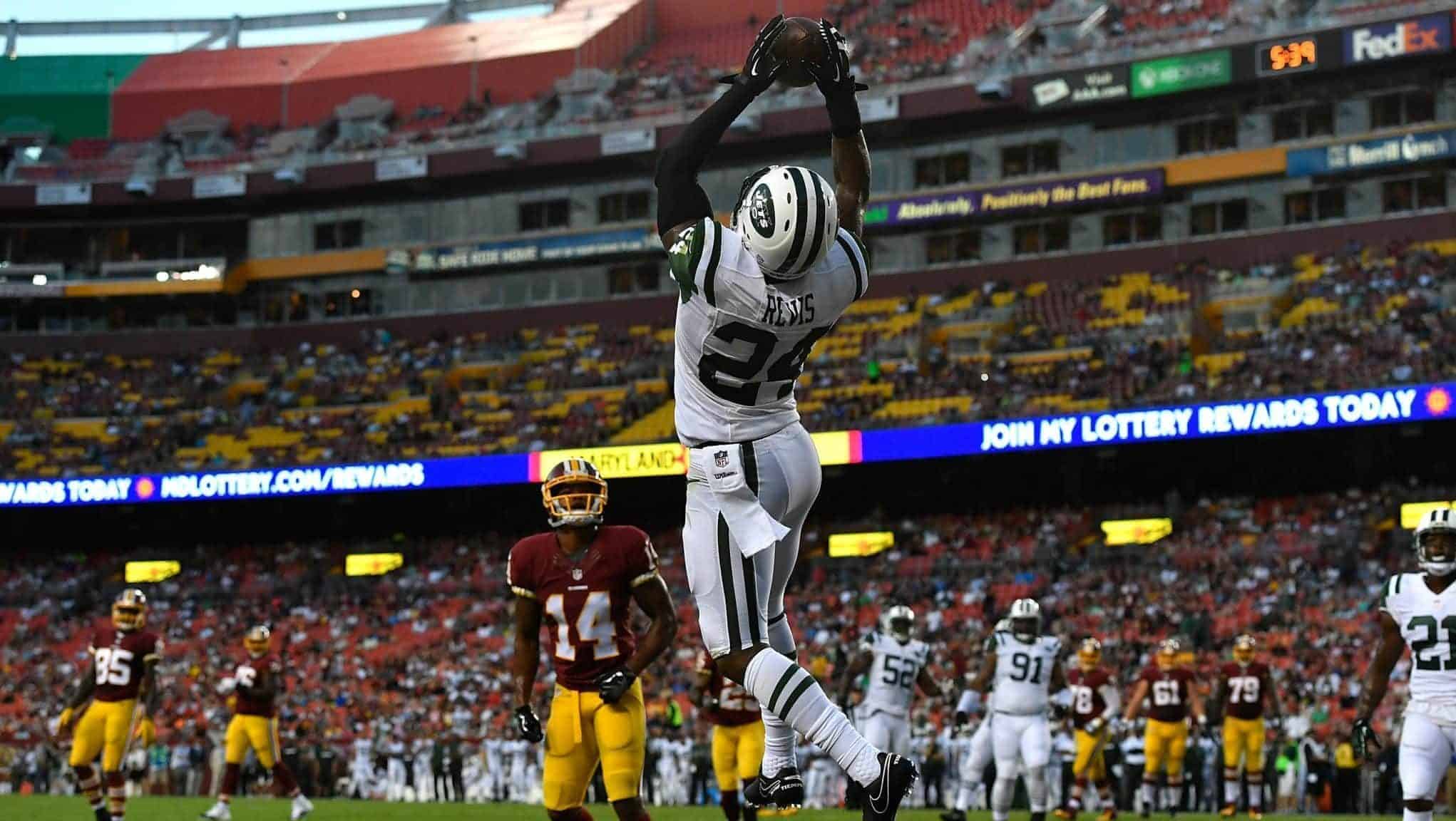 LANDOVER, MD - AUGUST 19: Cornerback Darrelle Revis #24 of the New York Jets makes a first half interception against the Washington Redskinsat at FedExField on August 19, 2016 in Landover, Maryland.