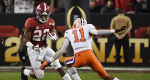 SANTA CLARA, CA - JANUARY 07: Najee Harris #22 of the Alabama Crimson Tide runs against Isaiah Simmons #11 of the Clemson Tigers in the CFP National Championship presented by AT&T at Levi's Stadium on January 7, 2019 in Santa Clara, California.