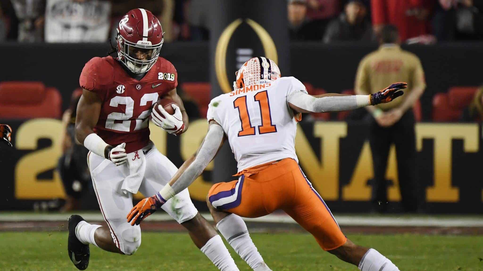 SANTA CLARA, CA - JANUARY 07: Najee Harris #22 of the Alabama Crimson Tide runs against Isaiah Simmons #11 of the Clemson Tigers in the CFP National Championship presented by AT&T at Levi's Stadium on January 7, 2019 in Santa Clara, California.
