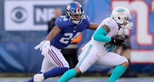 EAST RUTHERFORD, NEW JERSEY - DECEMBER 15: Albert Wilson #15 of the Miami Dolphins carries the ball as Julian Love #24 of the New York Giants defends in the second quarter at MetLife Stadium on December 15, 2019 in East Rutherford, New Jersey.