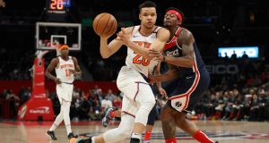 WASHINGTON, DC - MARCH 10: Kevin Knox II #20 of the New York Knicks dribbles past Bradley Beal #3 of the Washington Wizards during the first half at Capital One Arena on March 10, 2020 in Washington, DC. NOTE TO USER: User expressly acknowledges and agrees that, by downloading and or using this photograph, User is consenting to the terms and conditions of the Getty Images License Agreement.