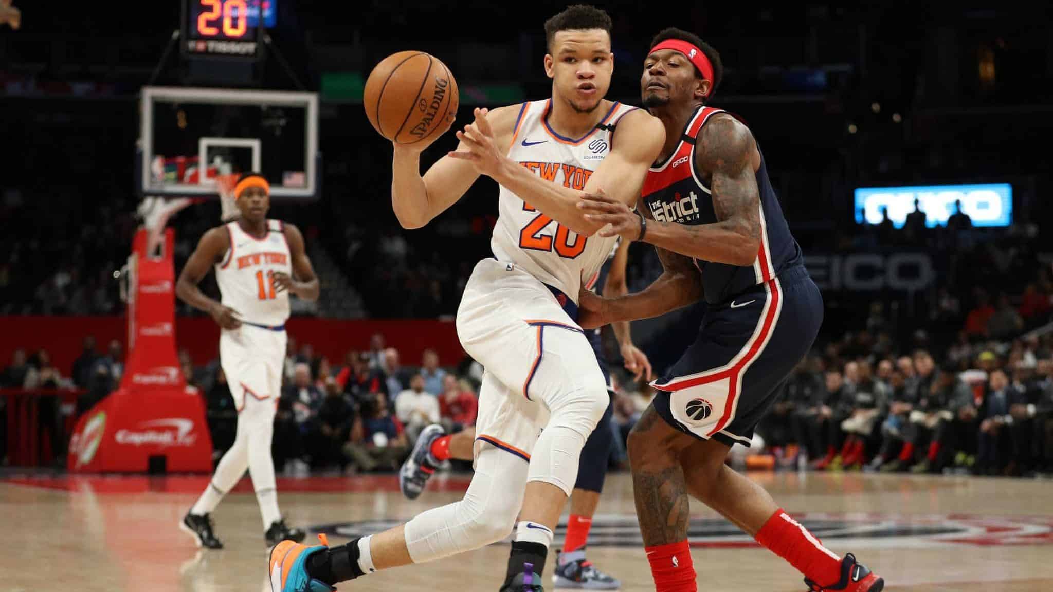 WASHINGTON, DC - MARCH 10: Kevin Knox II #20 of the New York Knicks dribbles past Bradley Beal #3 of the Washington Wizards during the first half at Capital One Arena on March 10, 2020 in Washington, DC. NOTE TO USER: User expressly acknowledges and agrees that, by downloading and or using this photograph, User is consenting to the terms and conditions of the Getty Images License Agreement.