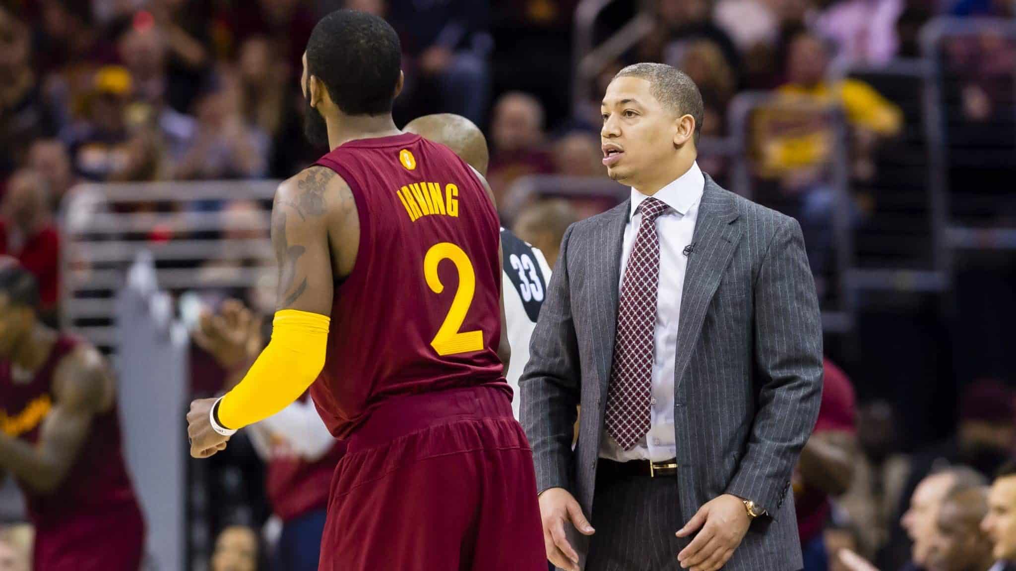 CLEVELAND, OH - DECEMBER 25: Kyrie Irving #2 of the Cleveland Cavaliers talks to head coach Tyronn Lue of the Cleveland Cavaliers during the first half against the Golden State Warriorsat Quicken Loans Arena on December 25, 2016 in Cleveland, Ohio. NOTE TO USER: User expressly acknowledges and agrees that, by downloading and/or using this photograph, user is consenting to the terms and conditions of the Getty Images License Agreement. Mandatory copyright notice.