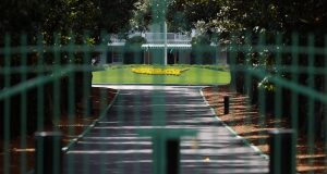 AUGUSTA, GEORGIA - MARCH 30: The gates are locked at the entrance of Magnolia Lane that leads to the clubhouse of Augusta National as the coronavirus pandemic causes closures of venues and nonessential businesses on March 30, 2020 in Augusta, Georgia. The Masters Tournament, the Augusta National Women’s Amateur and the Drive, Chip and Putt National Finals has been postponed due to the coronavirus (COVID-19) outbreak.