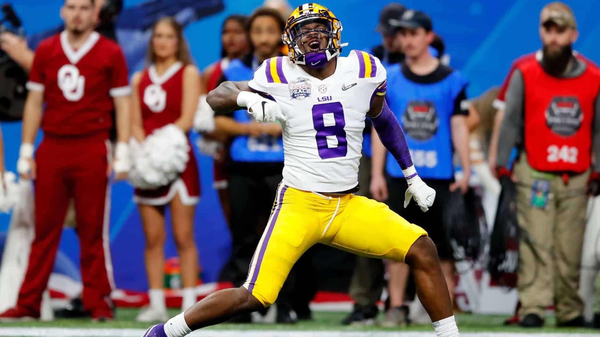 ATLANTA, GEORGIA - DECEMBER 28: Linebacker Patrick Queen #8 of the LSU Tigers celebrates a defensive play against the Oklahoma Sooners during the Chick-fil-A Peach Bowl at Mercedes-Benz Stadium on December 28, 2019 in Atlanta, Georgia.
