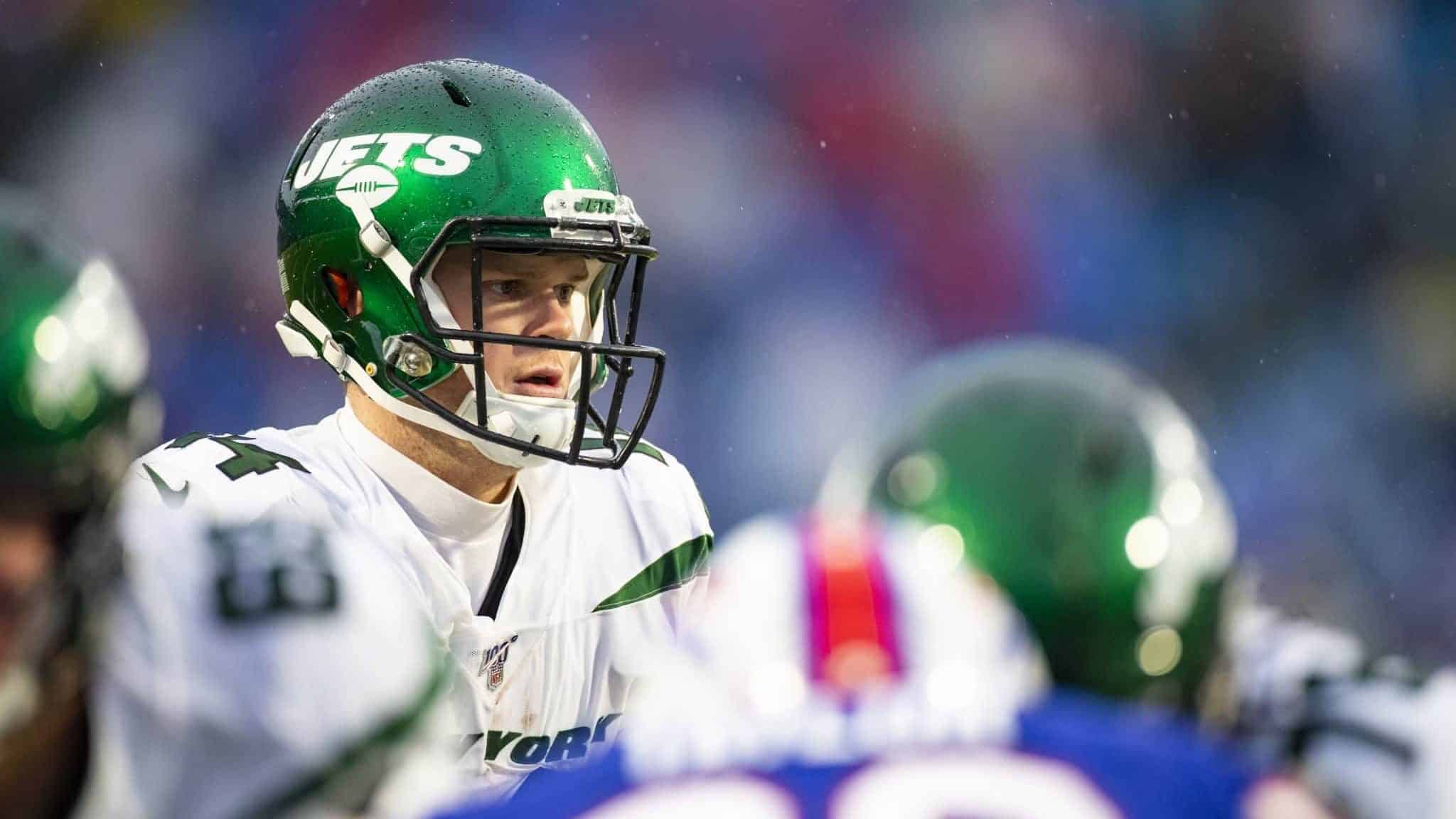ORCHARD PARK, NY - DECEMBER 29: Sam Darnold #14 of the New York Jets moves behind the line of scrimmage during the fourth quarter against the Buffalo Bills at New Era Field on December 29, 2019 in Orchard Park, New York.