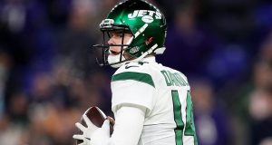 BALTIMORE, MARYLAND - DECEMBER 12: Quarterback Sam Darnold #14 of the New York Jets drops back to pass over the defense of the Baltimore Ravens during the game at M&T Bank Stadium on December 12, 2019 in Baltimore, Maryland.