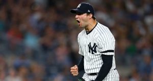 NEW YORK, NEW YORK - AUGUST 16: Tommy Kahnle #48 of the New York Yankees reacts after striking out Franmil Reyes #32 of the Cleveland Indians to end the top of the seventh inning at Yankee Stadium on August 16, 2019 in New York City.