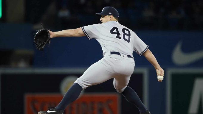 TORONTO, ON - MARCH 30: Tommy Kahnle #48 of the New York Yankees delivers a pitch in the eighth inning during MLB game action against the Toronto Blue Jays at Rogers Centre on March 30, 2018 in Toronto, Canada.