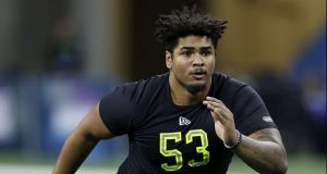 INDIANAPOLIS, IN - FEBRUARY 28: Offensive lineman Tristan Wirfs of Iowa runs a drill during the NFL Combine at Lucas Oil Stadium on February 28, 2020 in Indianapolis, Indiana.