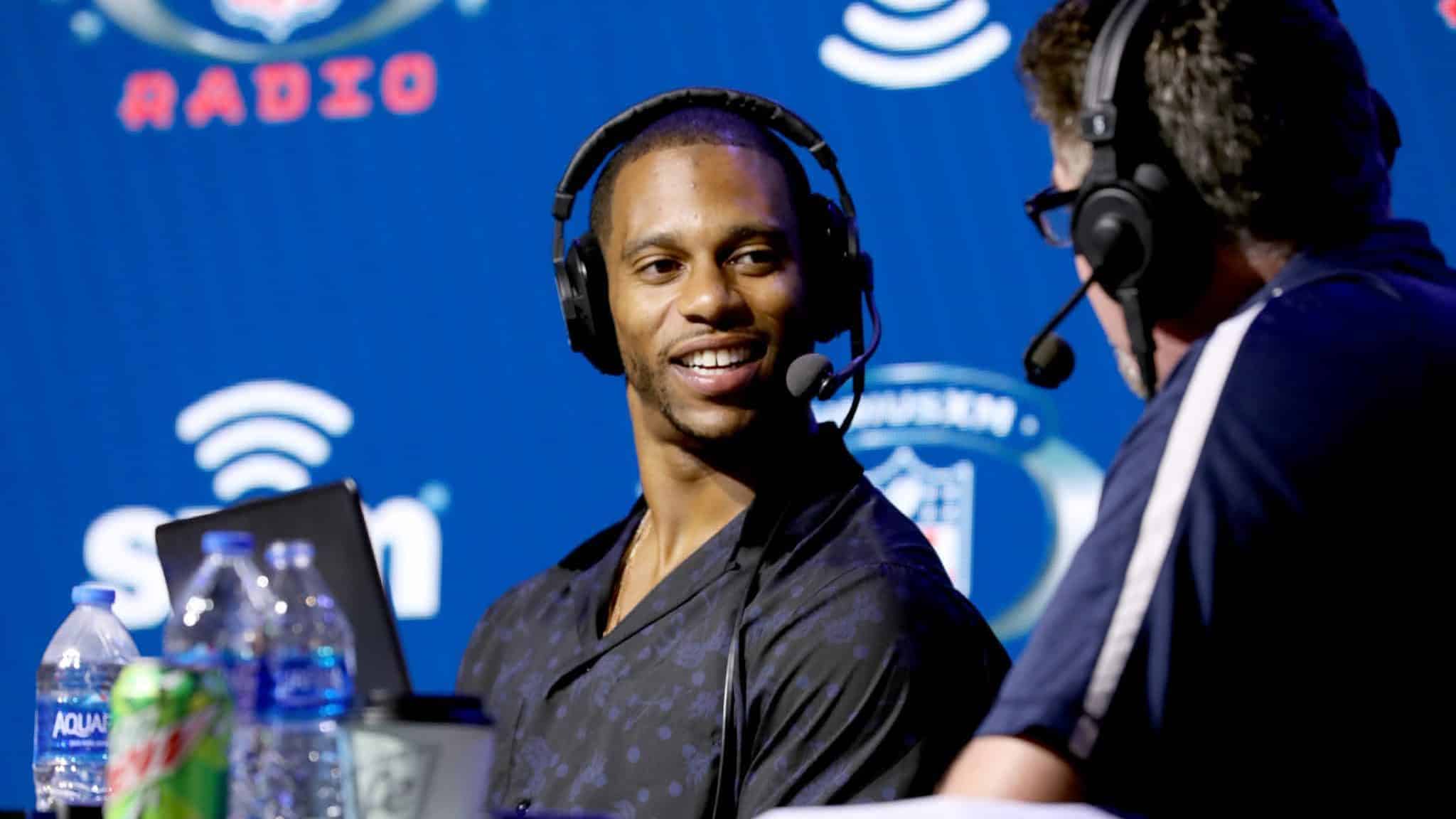 MIAMI, FLORIDA - JANUARY 29: Former NFL player Victor Cruz and SiriusXM host Jim Miller speak onstage during day 1 with SiriusXM at Super Bowl LIV on January 29, 2020 in Miami, Florida.