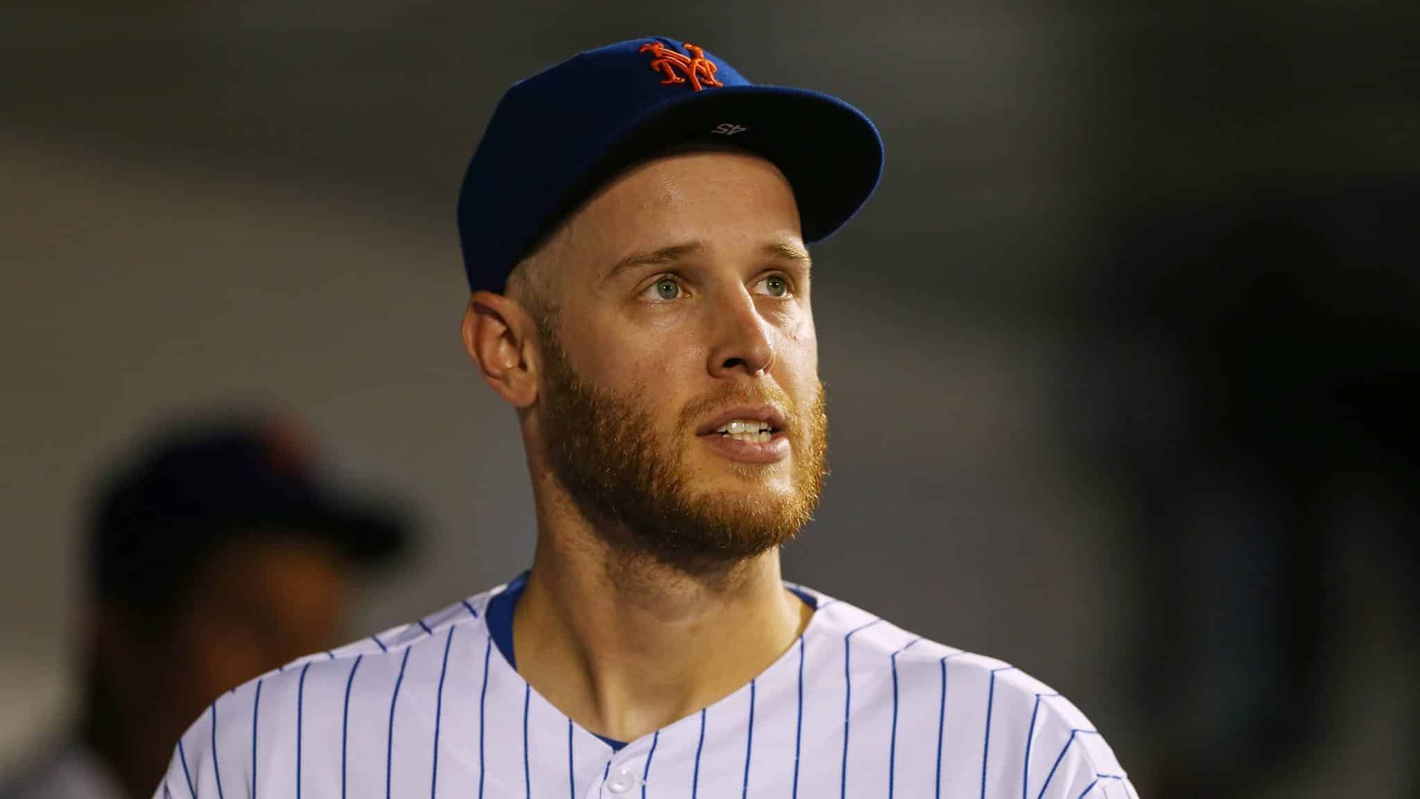 NEW YORK, NY - SEPTEMBER 15: Pitcher Zack Wheeler #45 of the New York Mets looks on from the dugout during the seventh inning of a game against the Los Angeles Dodgers at Citi Field on September 15, 2019 in New York City.