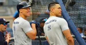 NEW YORK, NY - SEPTEMBER 14: Aaron Judge #99 and Giancarlo Stanton #27 of the New York Yankees look on during batting practice prior to the game against the Toronto Blue Jays at Yankee Stadium on September 14, 2018 in the Bronx borough of New York City.