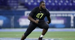 INDIANAPOLIS, IN - FEBRUARY 28: Offensive lineman Andrew Thomas of Georgia runs a drill during the NFL Combine at Lucas Oil Stadium on February 28, 2020 in Indianapolis, Indiana.